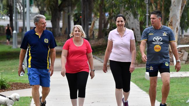 Queensland Premier Annastacia Palaszczuk (2nd right) is seen walking with Paul Jacob (left), ALP candidate for the seat of Hinchinbrook, Member for Mundingburra Coralee O'Rourke (2nd left) and Member for Thuringowa, Aaron Harper (right) through Riverside Park in Townsville, Tuesday, October 31, 2017 (AAP Image/Darren England) NO ARCHIVING