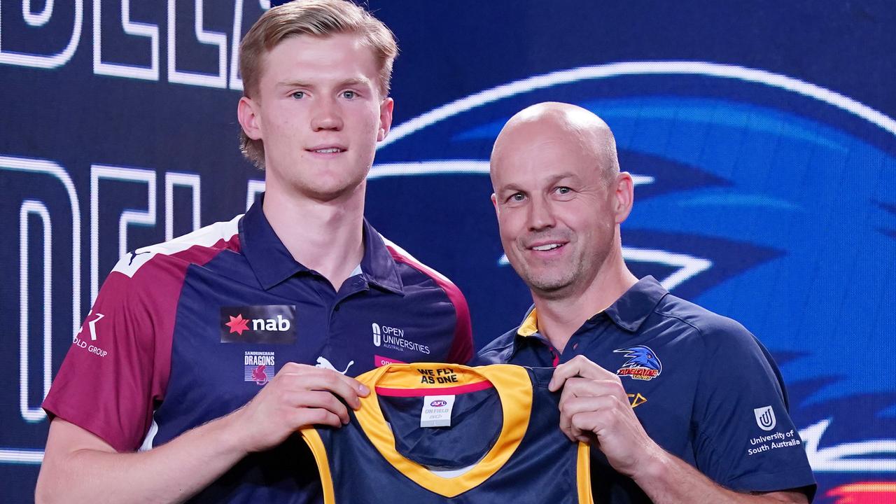 Fischer McAsey is presented with a jersey by Adelaide Crows coach Matthew Nicks on draft night. Picture: AAP Image/Michael Dodge