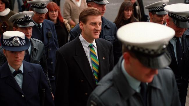 Victorian premier Jeff Kennett with a police escort in 1994.