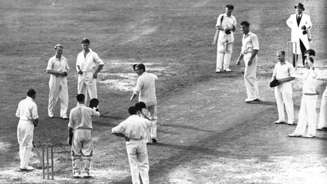 The England Captain leads the team in a special cheer for Don Bradman, the Australian Captain, who is playing his last Test Match at the Oval in 1948.