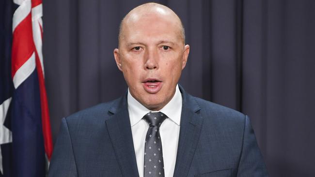 Peter Dutton accused Bill Shorten of offering a “backdoor” entry to Australia. Picture: AAP Image/Lukas Coch
