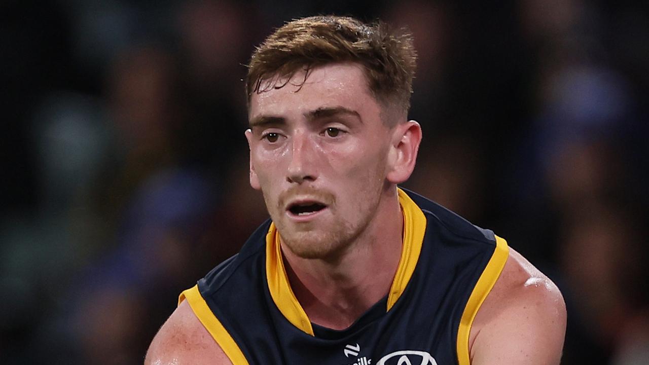 ADELAIDE, AUSTRALIA - JUNE 06: Mark Keane of the Crows handpasses the ball during the 2024 AFL Round 13 match between the Adelaide Crows and the Richmond Tigers at Adelaide Oval on June 06, 2024 in Adelaide, Australia. (Photo by James Elsby/AFL Photos via Getty Images)