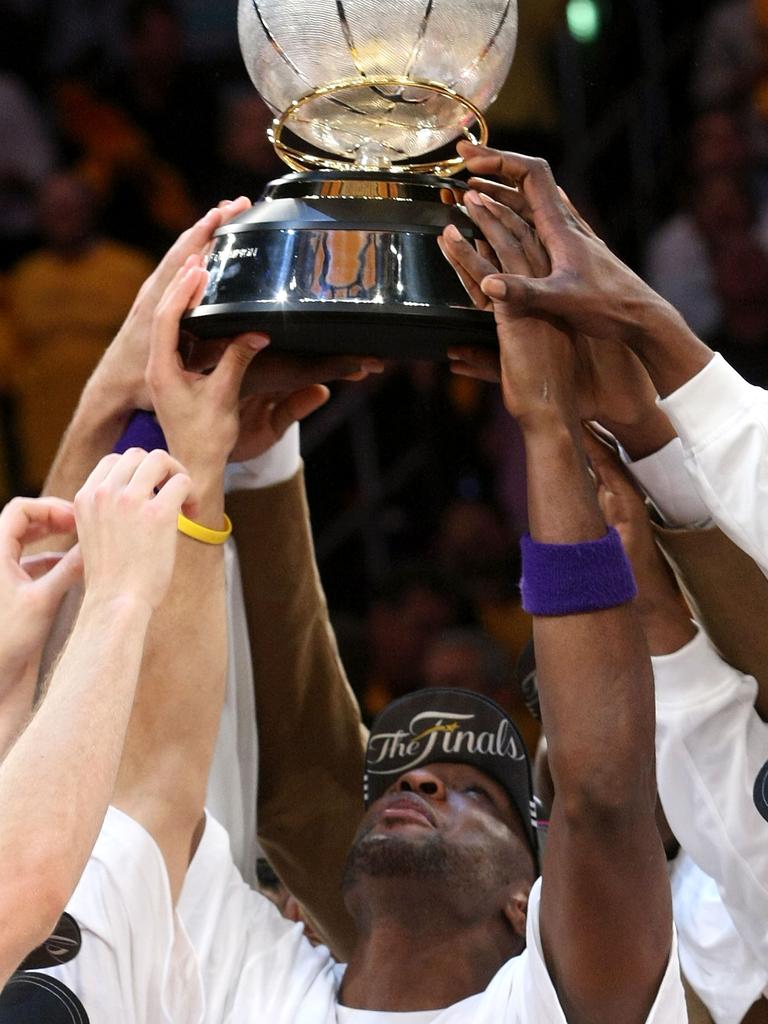 Lamar Odom of the Los Angeles Lakers looks up at the Western Conference Championship trophy after the Lakers defeated the San Antonio Spurs in Game Five of the Western Conference Finals during the 2008 NBA Playoffs on May 29, 2008 in Los Angeles. Picture: Getty