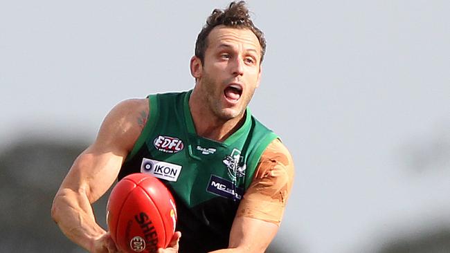 Essendon District Football League Premier Division match between Greenvale and Aberfeldie at Greenvale Reserve, Greenvale. Greenvale No. 8 Stephan Brewer in action.