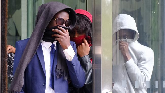 Ngor Dao leaves County Court with his siblings in tow after being sentenced to community corrections order for a horrific brawl in Sunshine that claimed the life of Staughton College student Pasawm Lyhym. Picture: NewsWire / Luis Enrique Ascui