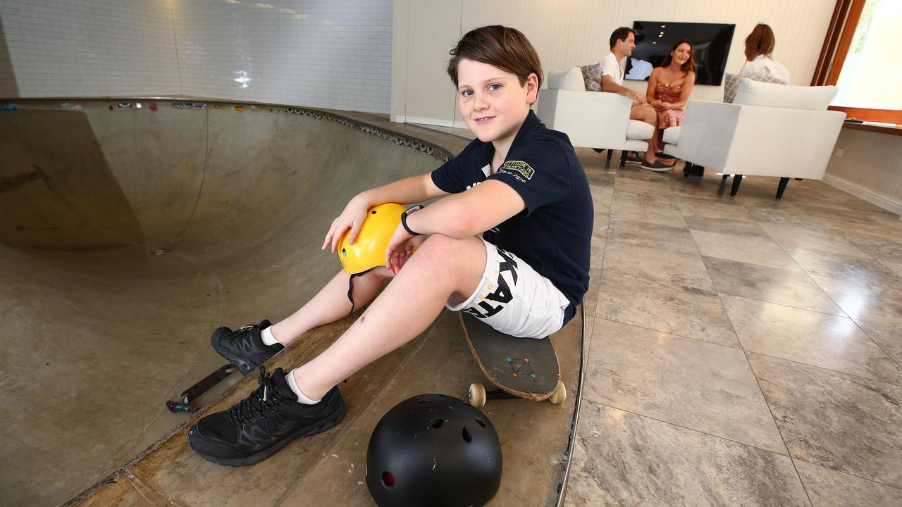 Riley Wood, 11, has a skate bowl in the living room of his Brisbane house, but not for much longer. His parents are selling the home. Picture: Adam Head