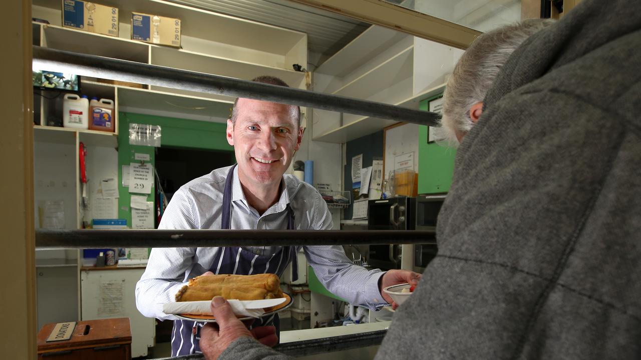 Give Where You Live CEO Bill Mithen at The Outpost dishing out some food. picture: Glenn Ferguson