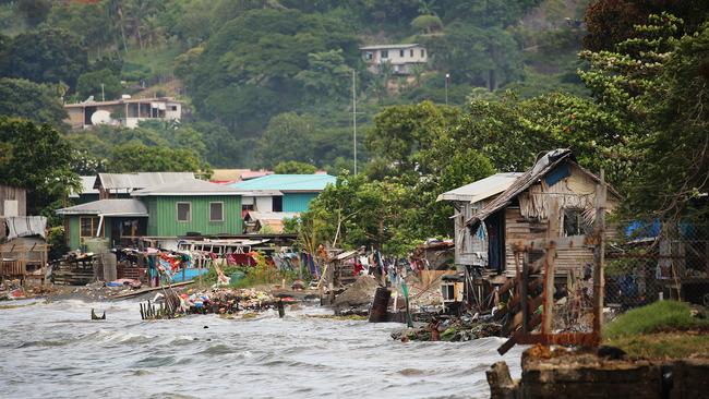 Less than 4 kms from the centre of town and the Australian High Commission children and families wash and swim in sewage and rubbish in Honiara, Solomon Islands. Picture: Vanessa Hunter