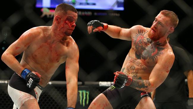 Nate Diaz punches Conor McGregor during their March, 2016 bout.