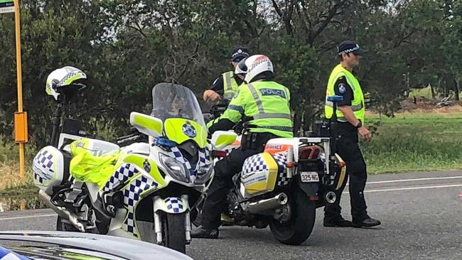 POLICE NEGOTIATIONS: A man is currently on the roof of a Woods St property in Depot Hill threatening to jump. Picture: Jann Houley