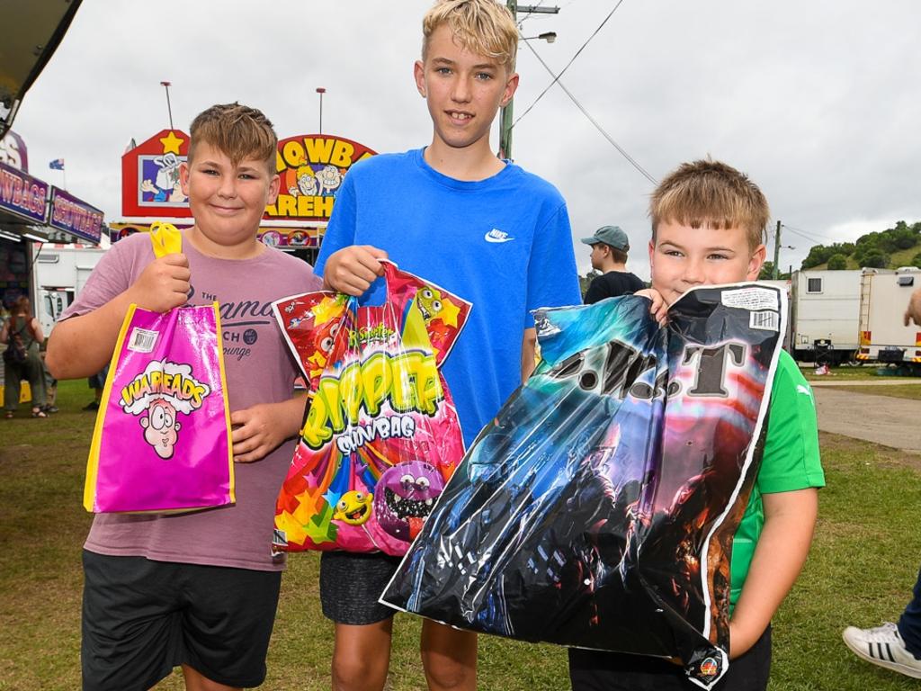 Lismore brothers Zeke, Kai, and Jack Kubils with their showbags hot off the wagon at the Lismore Show. Picture: Cath Piltz