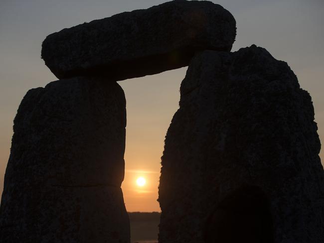 Singing stones ... the sun rises at the ancient stone circle Stonehenge, near Salisbury, on the Summer Solstice — the longest day of the year — on June 21, 2014.