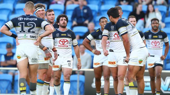 The Cowboys look dejected after a the Titans scored during the round 13 NRL match between the Gold Coast Titans and the North Queensland Cowboys at Cbus Super Stadium.