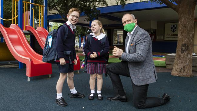 St James Catholic primary school principal Brendan Flanagan with kids Harry and Scarlett Cheshire on Friday. Picture: Aaron Francis