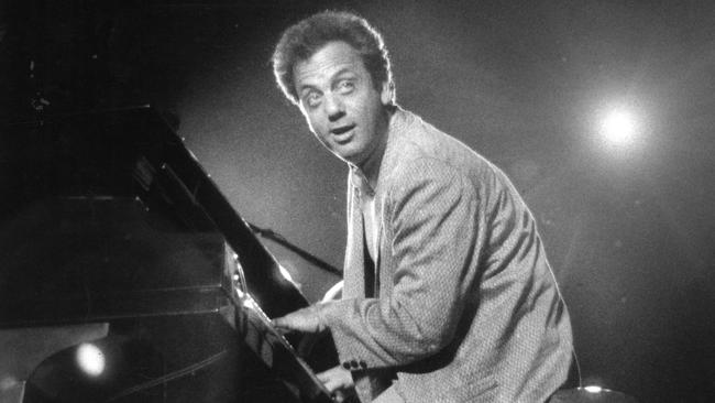 American singer Billy Joel performing at a concert at Thebarton Oval in October 1987.