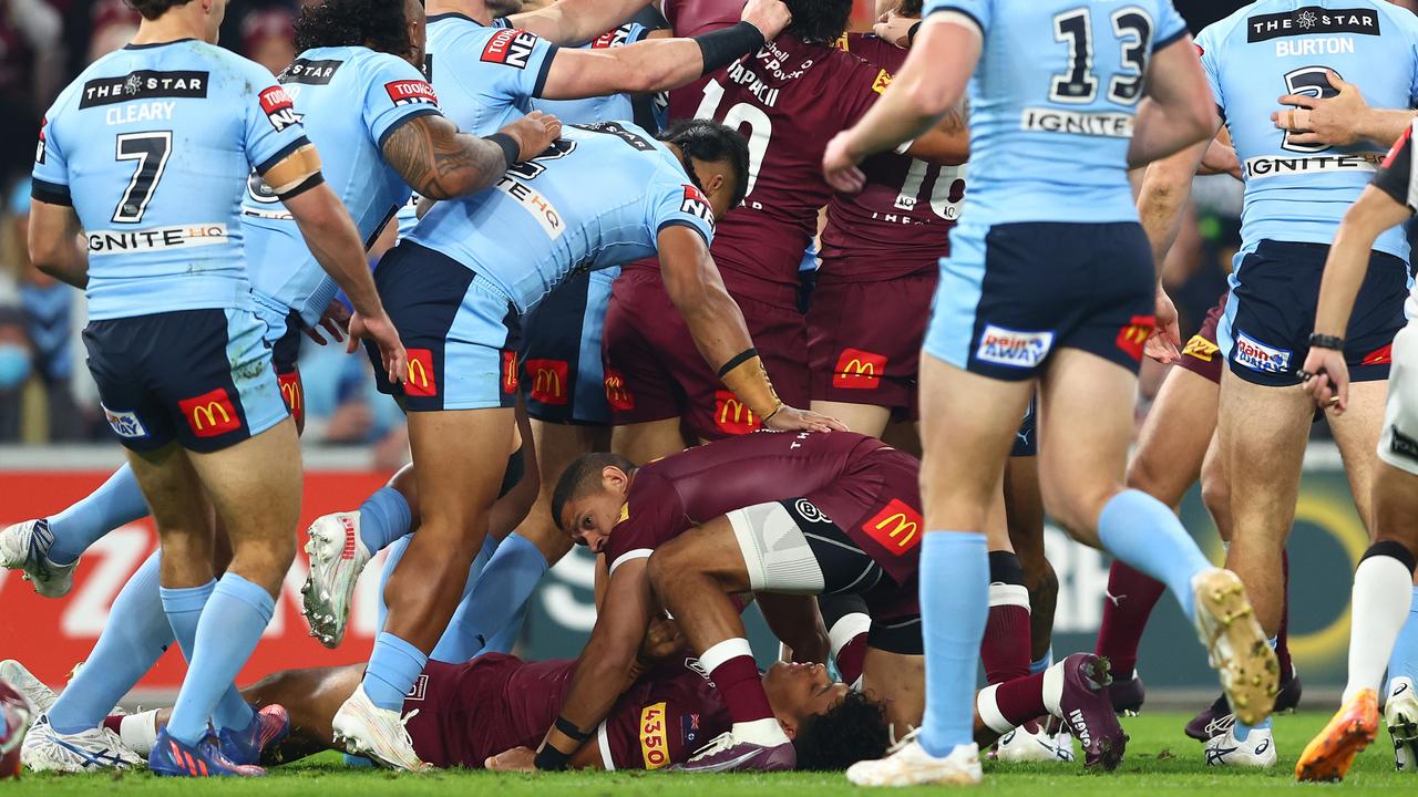 Selwyn Cobbo of the Maroons left on a stretcher. Photo by Chris Hyde/Getty Images.