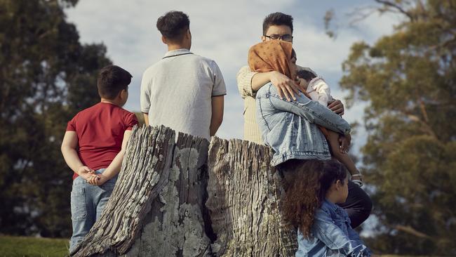 Safe: the refugee family contemplate their new life. Photo: Nick Cubbin