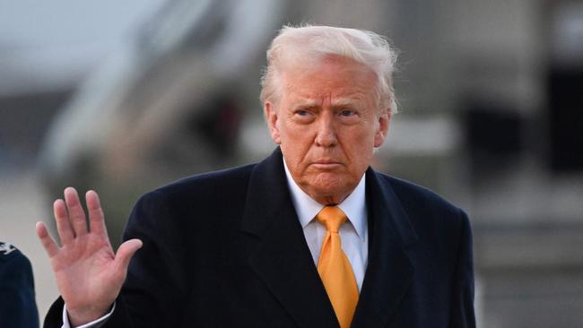 US President Donald Trump waves as he makes his way to board Air Force One at Joint Base Andrews in Maryland. Picture: AFP