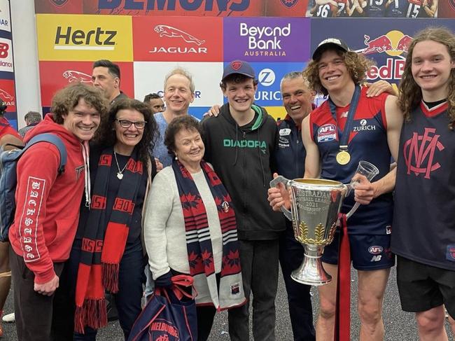 Ben Brown with his family and the 2021 premiership cup in the rooms after the game. Picture: Instagram