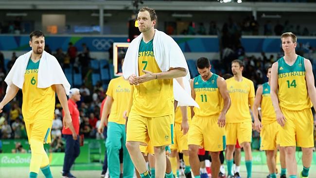 Andrew Bogut, Joe Ingles and Brock Motum of Australia walk off the court.