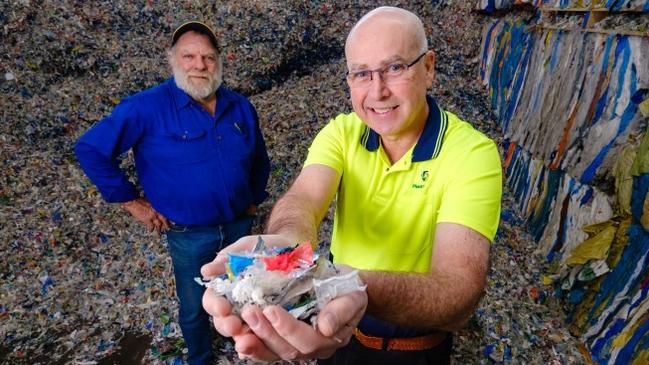 Tumbarumba NSW beef farmer Steve McKay, left, was a victim of the Black Summer bushfires. The Coles Nurture Fund supported Plastic Forests in developing and producing recycled soft plastic fence posts that Mr McKay has since installed on his property. Plastic Forests Managing Director David Hodge is holding a handful soft plastic material. Picture: supplied.