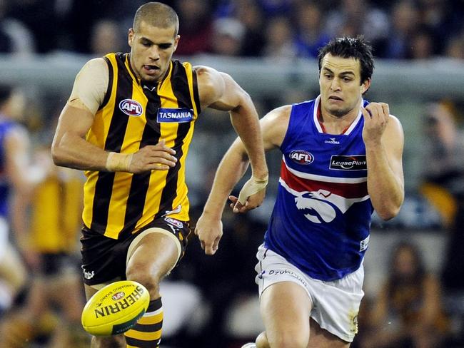 Lance Franklin in front of his future teammate Brian Lake in 2008. Picture: Colleen Petch