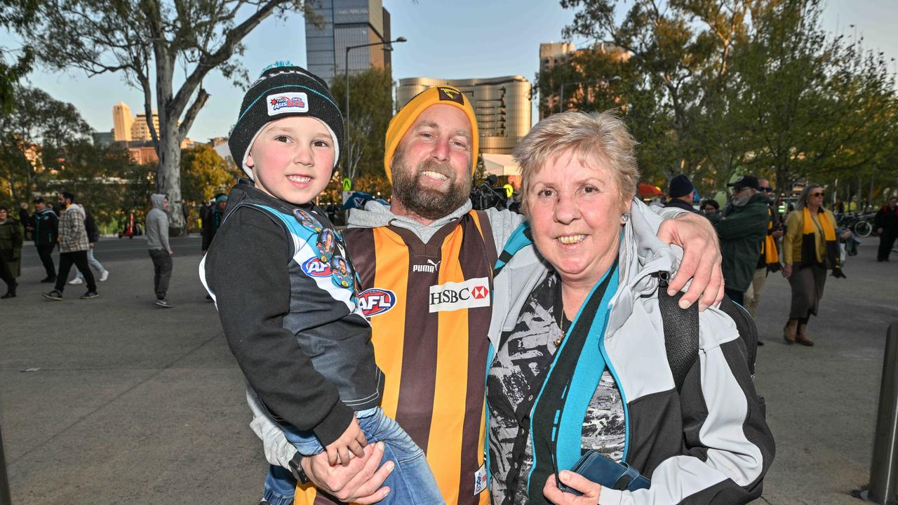 SEPTEMBER 13, 2024: Fans arriving for the Port v Hawthorn semi final at Adelaide Oval. Drew Lamont with son Callan 5yo and mother in law Liz McHugh. Picture: Brenton Edwards