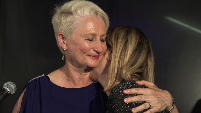 Independent candidate for Wentworth Kerryn Phelps (left) is embraced by her wife Jackie Stricker-Phelps during her victory speech. Picture: AAP