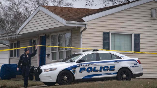 Police stand guard outside the home of 15-year-old Natalie Rupnow. Picture: Getty Images via AFP.