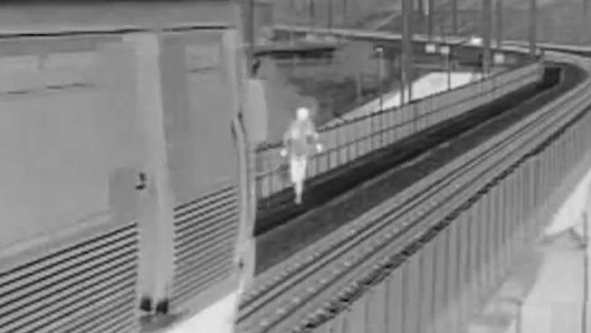 This commuter is seen running from a moving train for no discernible reason. Picture: Queensland Rail