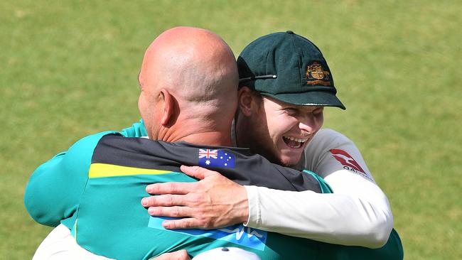 Steve Smith (right) hugs coach Darren Lehmann