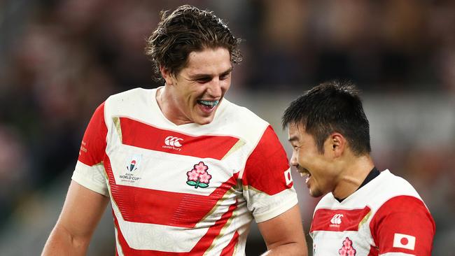 FUKUROI, JAPAN - SEPTEMBER 28: James Moore (L) and Fumiaki Tanaka of Japan celebrate victory following the Rugby World Cup 2019 Group A game between Japan and Ireland at Shizuoka Stadium Ecopa on September 28, 2019 in Fukuroi, Shizuoka, Japan. (Photo by Cameron Spencer/Getty Images)