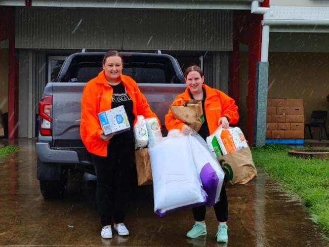 The Townsville Woolworths team delivers supplies to one of Townsville's evacuation centres. Picture: Supplied.