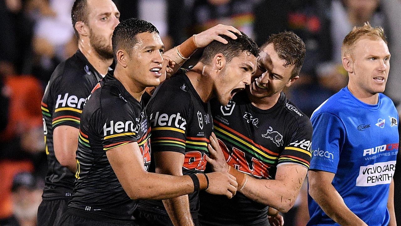 Nathan Cleary of the Panthers celebrates with teammates after converting a try to force golden point during Round 4.