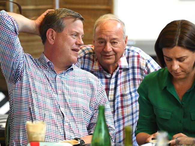 Still not conceded, Queensland LNP leader Tim Nicholls, flanked by his deputy Deb Frecklington (right), and his father Peter in a Brisbane cafe. Picture: Dan Peled/AAP