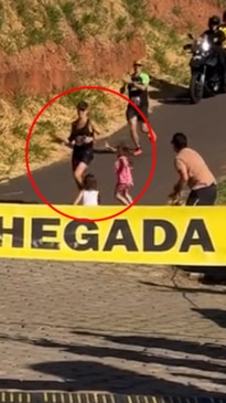 Man slammed for bringing children out in front of marathon finish line