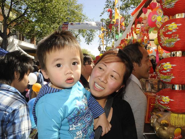 Sandy Tran with her son Bryan Le, 1, from Canley Vale at the Cabramatta Moon festival.