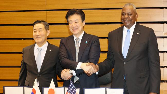 South Korean Defence Minister Shin Won-sik, Japanese Defense Minister Minoru Kihara amd US Defence Secretary in Tokyo on Sunday. Picture: AFP