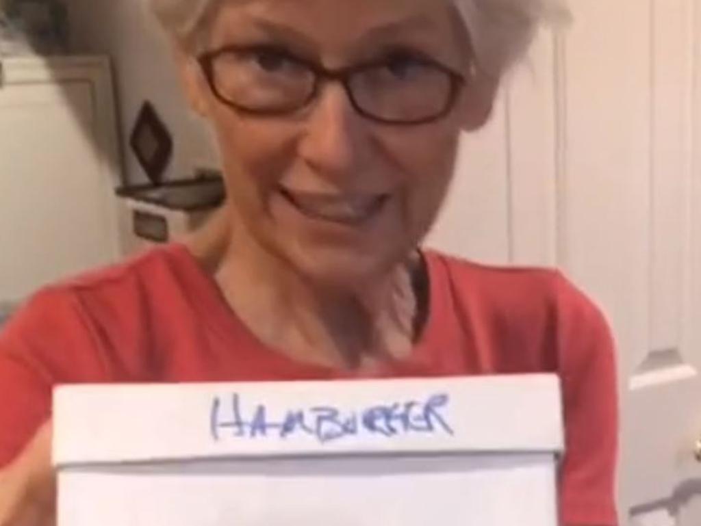 The woman keeps the meal in a box marked "hamburger".