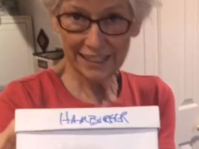 The woman keeps the meal in a box marked "hamburger".