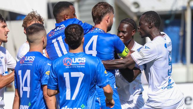 MELBOURNE, AUSTRALIA - FEBRUARY 10 2024 A fight breaks out between Avondale and Dandenong City during the NPL Victoria game between Avondale v Dandenong City at Reggio Calabria Club.Picture: Brendan Beckett