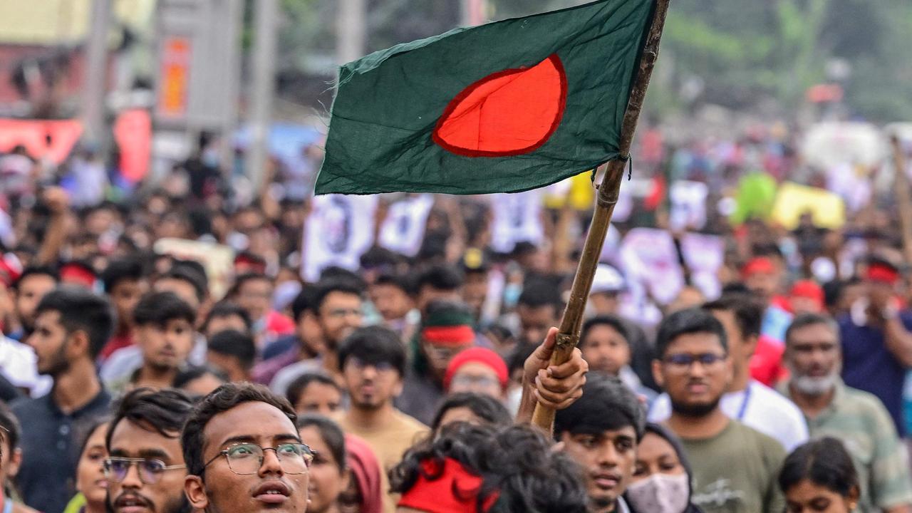 A student carrying Bangladesh national flag takes part in a protest march. Picture: Munir Uz Zaman/AFP