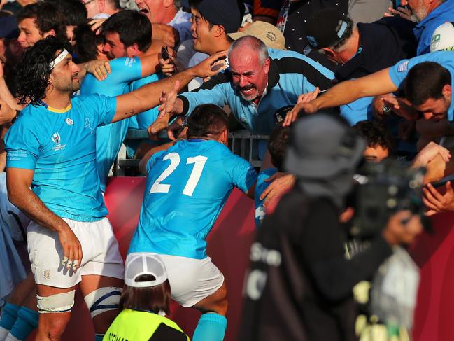 Uruguay players celebrate with friends and family.