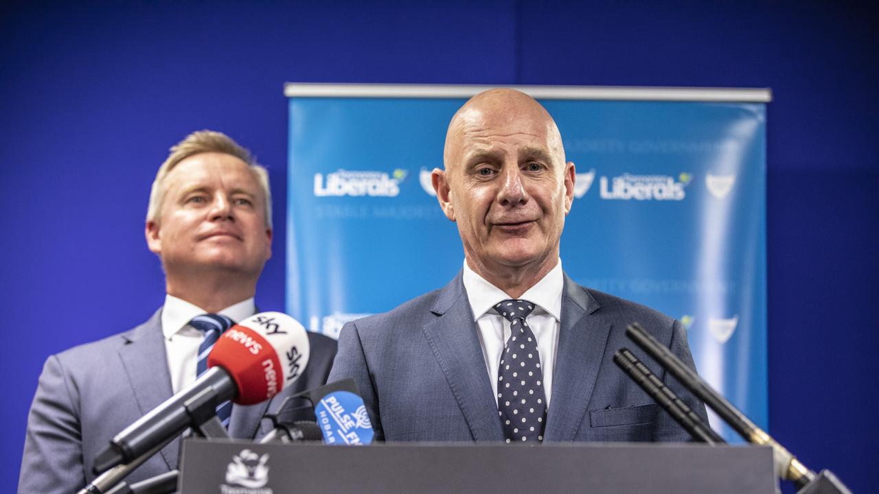 New Tasmanian Premier Peter Gutwein speaks to the media while Deputy Premier Jeremy Rockliff looks on during a press conference in Hobart, Monday, January 20, 2020. Mr Gutwein was unanimously endorsed as the 46th premier on Monday, after the only other person running, senior minister Michael Ferguson, stepped away from the race hours before a vote. (AAP Image/Eddie Safarik) NO ARCHIVING
