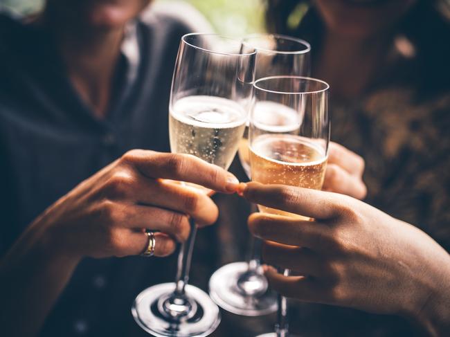 Three female friends celebrating with champagne. They are sitting in a bar and toasting with glasses of champagne.  Picture: istock