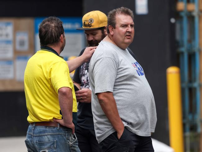 Workers outside a Probuild site in Elizabeth St. Melbourne. Picture: Ian Currie.