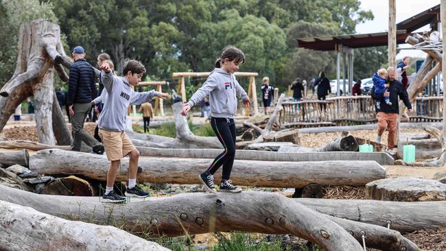 Zoe, 8, with brother Samuel, 11, at the opening of Glenthorne National Park-Ityamaiitpinna Yarta Adventure playground. Image: Russell Millard Photography