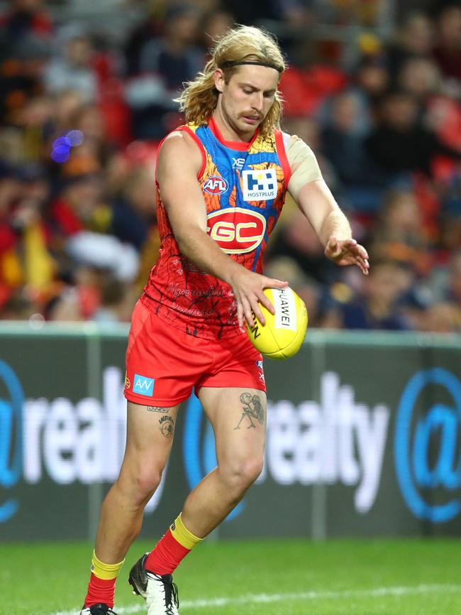 GOLD COAST, AUSTRALIA - JULY 13: Brad Scheer of the Suns kicks during the round 17 AFL match between the Gold Coast Suns and the Adelaide Crows at Metricon Stadium on July 13, 2019 in Gold Coast, Australia. (Photo by Chris Hyde/Getty Images)