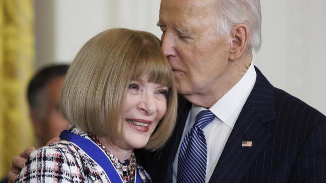 Mr Biden giving Anna Wintour a little kiss, for some reason. Picture: Tom Brenner/Getty