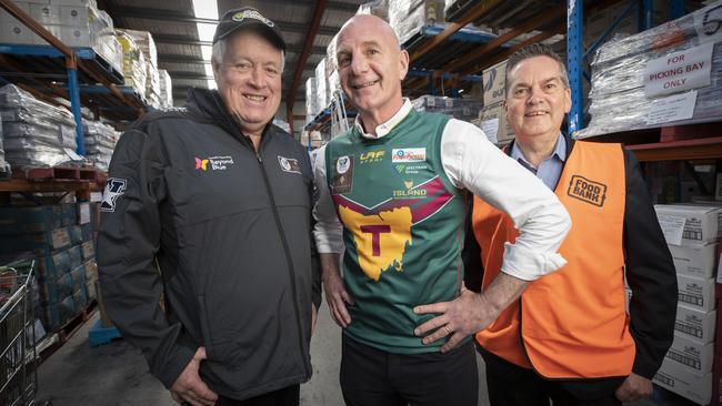 Relive the Rivalry co ordinator Jaimes Wiggins, former Tasmanian Premier Peter Gutwein and Foodbank deputy chair Rob Higgins at Derwent Park. Picture: Chris Kidd